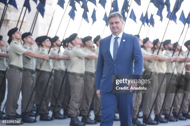 Chairman of the Council of Ministers of Bosnia and Herzegovina, Denis Zvizdic walks past the honour guard as he arrives at the Western Balkans summit...