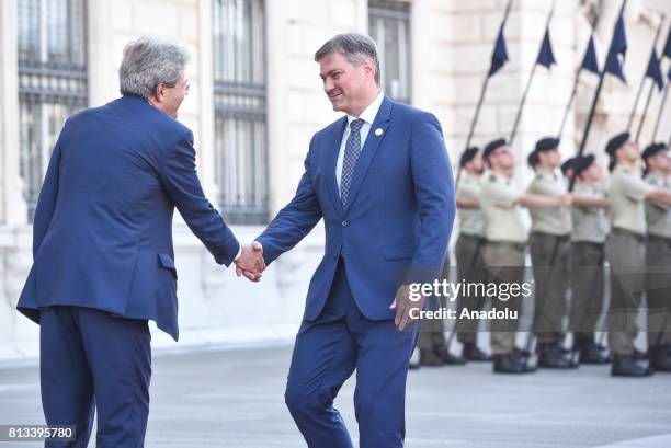 Italy's Prime Minister Paolo Gentiloni and Chairman of the Council of Ministers of Bosnia and Herzegovina, Denis Zvizdic shake hands during the...