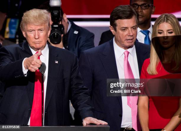 Nominee Donald Trump, flanked from left by campaign manager Paul Manafort, and daughter Ivanka Trump, checks the podium early Thursday afternoon in...