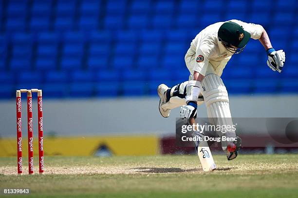 Michael Hussey of Australia stretches to make his ground during day four of the Second Test match between West Indies and Australia at Sir Vivian...