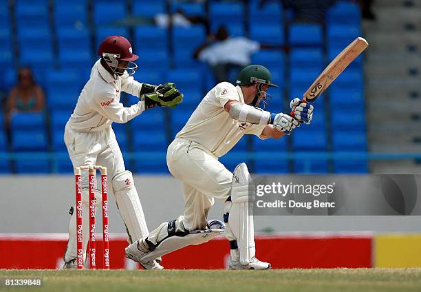 Michael Hussey of Australia is caught by Denesh Ramdin of West Indies during day four of the Second Test match between West Indies and Australia at...