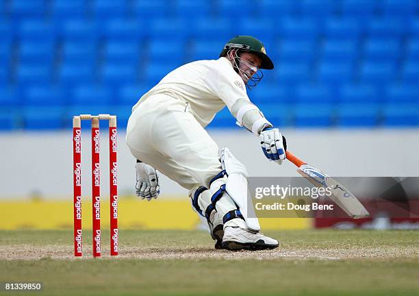 Michael Hussey of Australia reaches out for a touch on a double by teammate Phil Jaques on day four of the Second Test match between West Indies and...