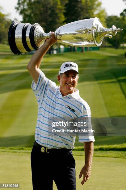 Jay Haas holds the Alfred S. Bourne trophy after winning the 69th Senior PGA Championship at Oak Hill Country Club - East Course on May 25, 2008 in...