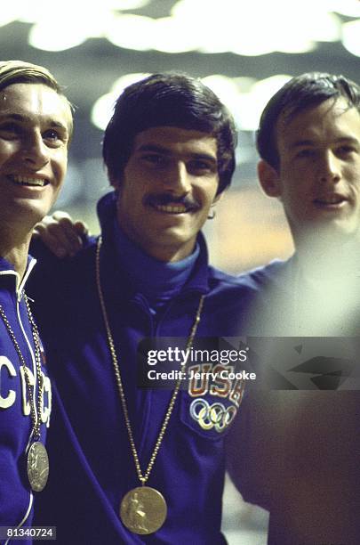 Swimming: 1972 Summer Olympics, USR Vladimir Bure, USA Mark Spitz, and USA Jerry Heidenreich victorious with medal after winning 100M freestyle race,...
