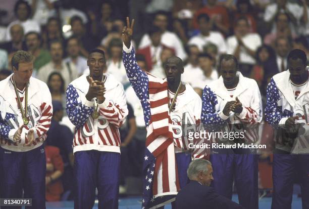 Basketball: 1992 Summer Olympics, USA Larry Bird, Scottie Pippen, Michael Jordan, Clyde Drexler, and Karl Malone victorious with USA flag after...