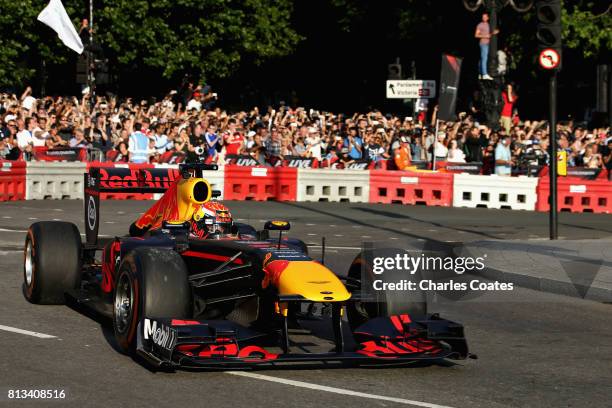 Max Verstappen of Netherlands and Red Bull Racing drives the Red Bull Racing RB7 during F1 Live London at Trafalgar Square on July 12, 2017 in...