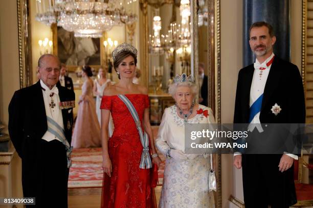 Britain's Queen Elizabeth II, her husband Prince Philip, Duke of Edinburgh, King Felipe VI of Spain and Queen Letizia of Spain pose for a group...