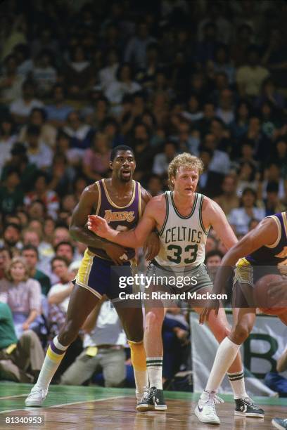 Basketball: finals, Los Angeles Lakers Magic Johnson in action, fighting for position vs Boston Celtics Larry Bird , Boston, MA 5/27/1984