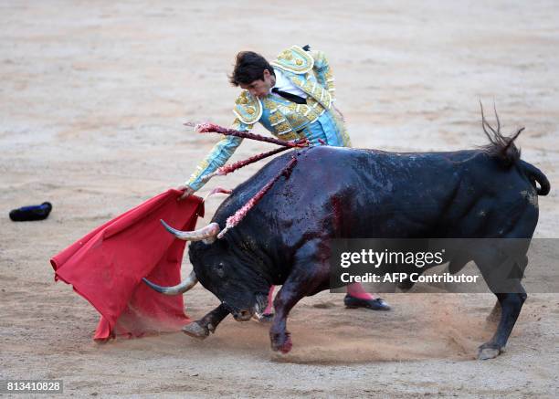 French matador Sebastian Castella performs a pass on a Victoriano del Rio Cortes' fighting bull during the sixth bullfight of the San Fermin Festival...