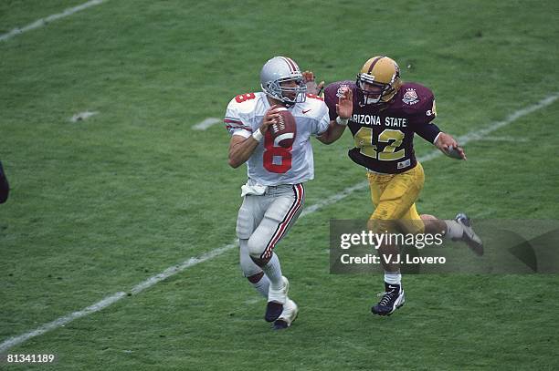 College Football: Rose Bowl, Ohio State QB Stanley Jackson in action, under pressure vs Arizona State Pat Tillman , Pasadena, CA 1/1/1997