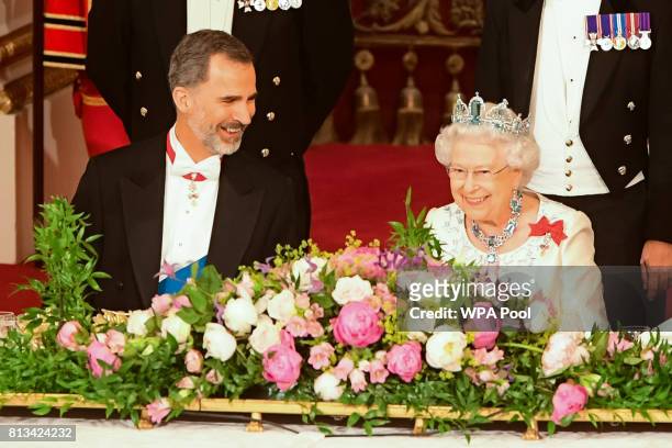 Britain's Queen Elizabeth II, and King Felipe VI of Spain attend a State Banquet at Buckingham Palace on July 12, 2017 in London, England. This is...
