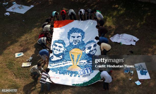 Students from L.S. Raheja Technical Institute & Arts create images of their cricketing heroes using paper balls. The Kalpotsav annual exhibition 2011...