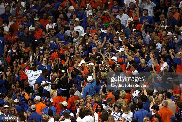 College Basketball: NCAA Final Four, Aerial view of Florida Joakim Noah victorious, hugging mother Cecilia Rhode after winning championship game vs...