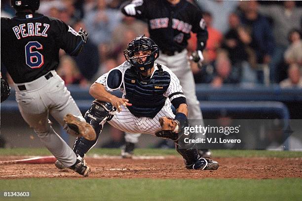 Baseball: World Series, New York Yankees Jorge Posada in action, tagging out sliding New York Mets Timo Perez , Bronx, NY