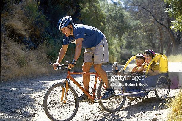 Senior Writer: Austin Murphy in action, training and riding bicycle with his children, San Anselmo, CA 5/16/2002