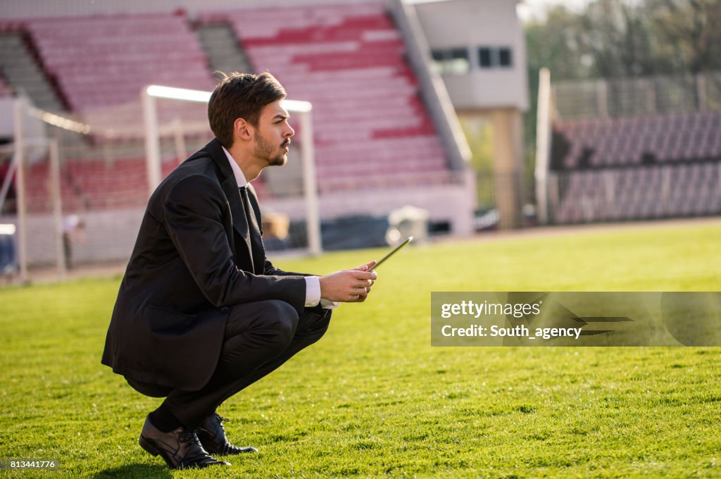 Football trainer on the soccer field