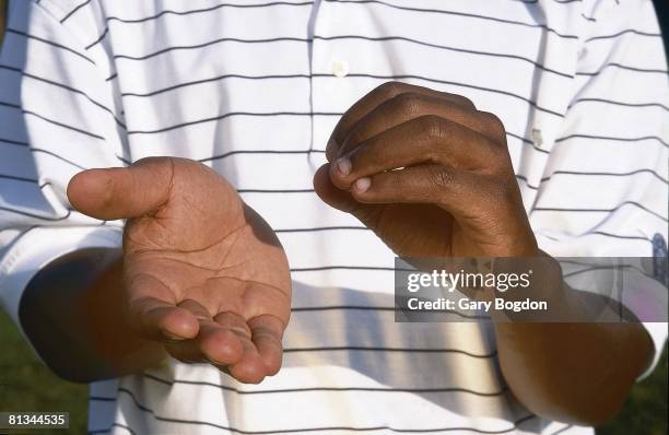 College Golf: Closeup portrait of Ohio State Kevin Hall disabled, deaf athlete's hands using sign language to convey hitting ball fast at Wild Wing...