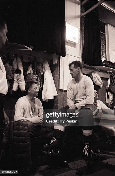 Hockey: Detroit Red Wings goalie Hank Bassen and Gordie Howe in locker room after game vs Montreal Canadiens, Detroit, MI