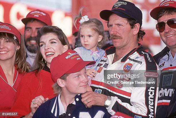 Auto Racing: NASCAR Atlanta Journal 500, Closeup of Dale Earnhardt Sr, with son Dale Earnhardt Jr, Hampton, GA