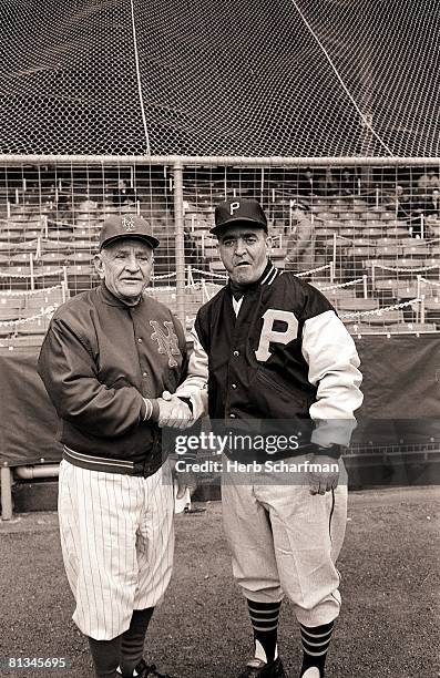Baseball: New York Mets manager Casey Stengel and Pittsburgh Pirates manager Danny Martaugh shaking hands before opening day game, New York, NY...