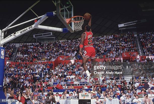 Basketball: NBA Slam Dunk Contest, Chicago Bulls Michael Jordan in action, making dunk during All Star Weekend, Seattle, WA 2/8/1987