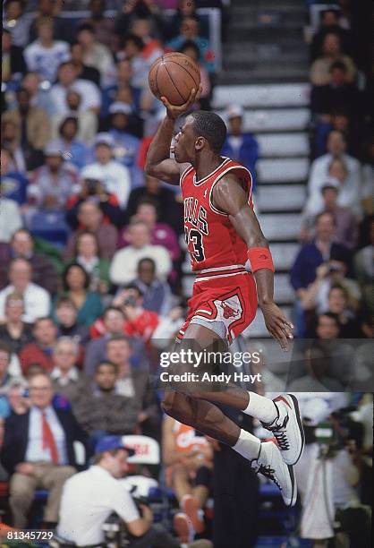 Basketball: NBA Slam Dunk Contest, Chicago Bulls Michael Jordan in action, making dunk during All Star Weekend, Seattle, WA 2/8/1987