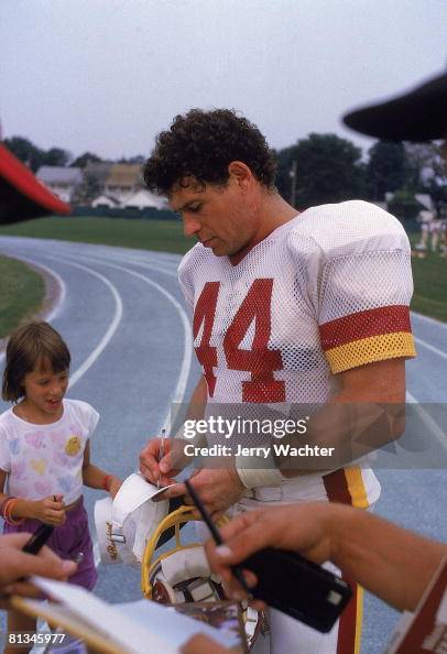 John Riggins Signing Washington Redskins John Riggins with fan signing autographs during ...