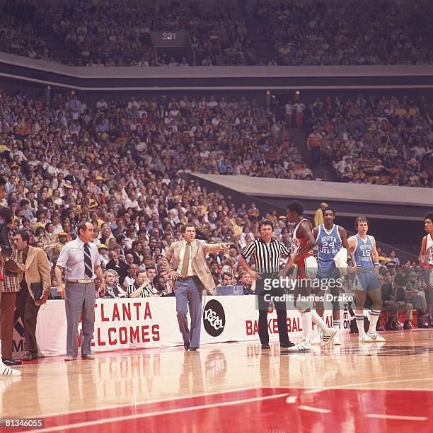 College Basketball: NCAA Final Four, North Carolina coach Dean Smith and UNLV coach Jerry Tarkanian on sidelines during game, Atlanta, GA 3/26/1977