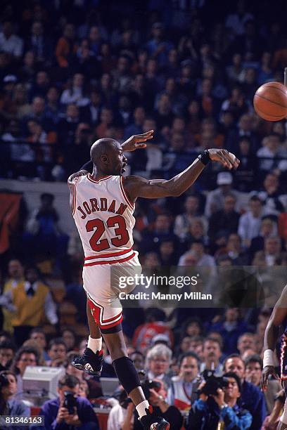 Basketball: NBA playoffs, Rear view of Chicago Bulls Michael Jordan in action, making pass vs New York Knicks, Chicago, IL 6/4/1993