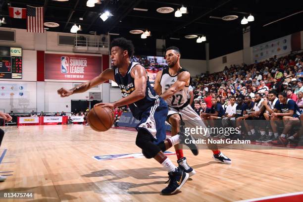 James Young of the New Orleans Pelicans handles the ball during the game against the Atlanta Hawks during the 2017 Las Vegas Summer League on July...
