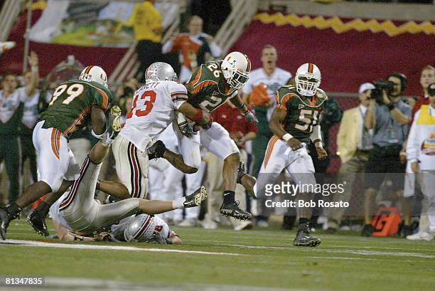 Coll, Football: Fiesta Bowl, Ohio State's Maurice Clarett in action, making strip vs Miami Sean Taylor during interception return, Tempe, AZ 1/3/2003