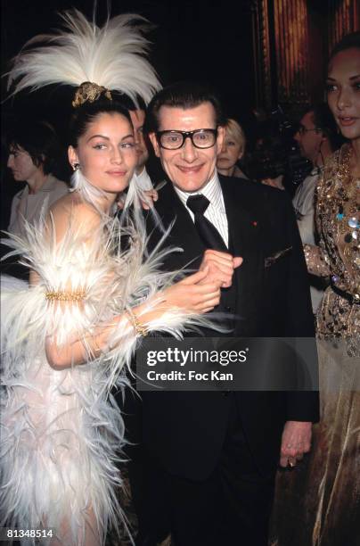 Laetitia Casta and Yves Saint Laurent attend the Miro Exhibition at the Pompidou Center Museum on January 15, 2000 in Paris France.