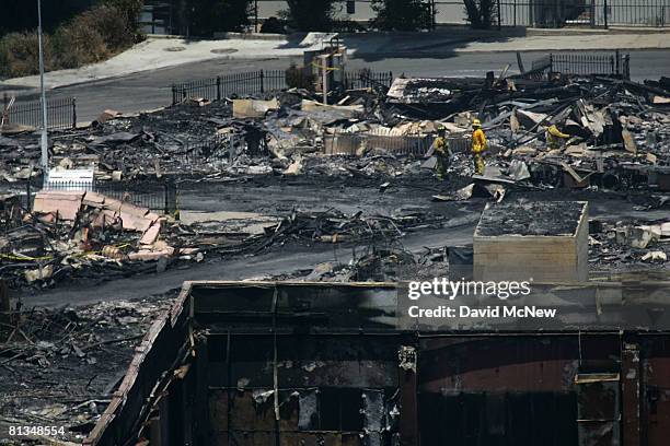 Fire investigators search for clues in the ruins of the Universal Studios backlot, on June 2, 2008 in Universal City, California. The fire destroyed...