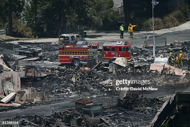 Fire investigators search for clues in the ruins of the Universal Studios backlot, on June 2, 2008 in Universal City, California. The fire destroyed...