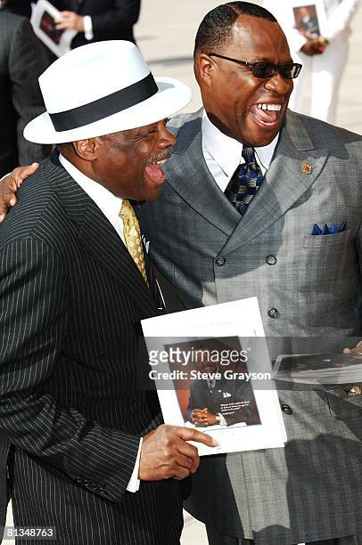 Willie Brown and Tony Muhammed arrive at the memorial service for Johnnie Cochran at West Angeles Cathederal in Los Angeles, California April 6, 2005