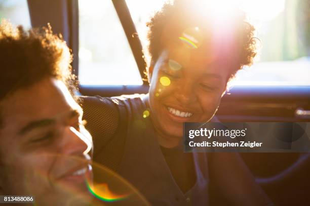 a young couple in a car - automotive trend stock pictures, royalty-free photos & images