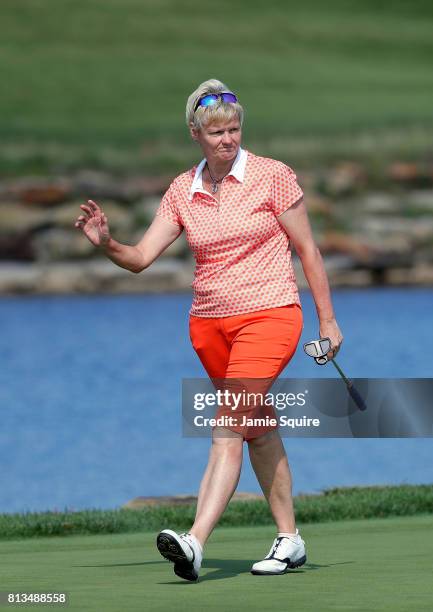 Trish Johnson of England waves as she walks up the 16th hole during the final round of the Senior LPGA Championship at the French Lick Resort on July...