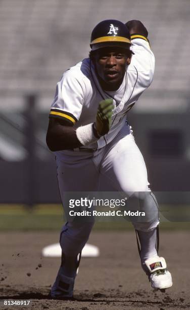 Rickey Henderson of the Oakland Athletics runs to third base in August 1982 in Oakland, California