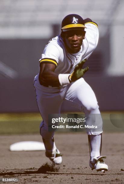 Rickey Henderson of the Oakland Athletics runs to third base in August 1982 in Oakland, California.