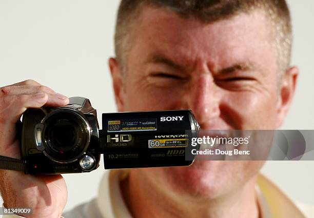 Stuart MacGill of Australia uses his camcorder at the end of play on day four of the Second Test match between West Indies and Australia at Sir...
