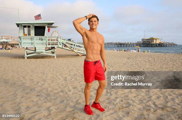 Madame Tussauds Hollywood's new Zac Efron 'Baywatch' wax figure heads to the beach at Santa Monica Pier on July 10, 2017 in Santa Monica, California.