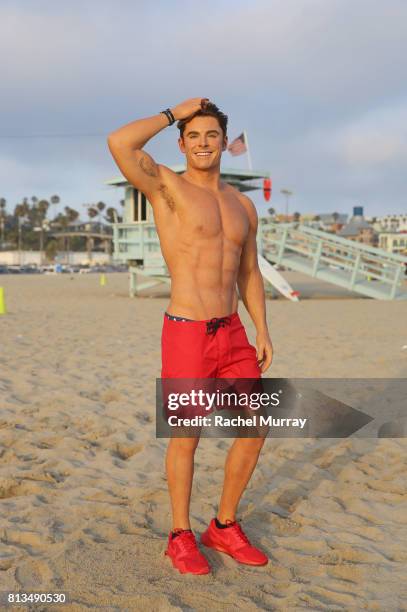 Madame Tussauds Hollywood's new Zac Efron 'Baywatch' wax figure heads to the beach at Santa Monica Pier on July 10, 2017 in Santa Monica, California.