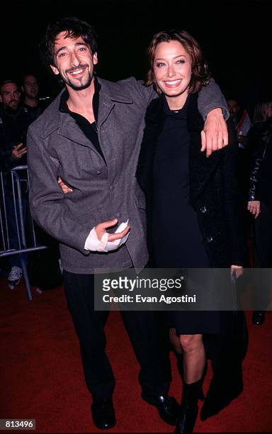 Adrien Brody and his girlfiend arrive at the world premiere of the new Paramount Pictures film "Bringing out the Dead" at the Ziegfeld Theater in New...