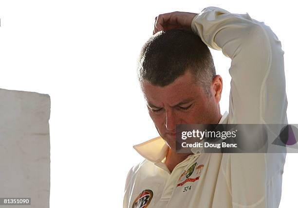 Stuart MacGill of Australia comes onto the field at the end of play on day four of the Second Test match between West Indies and Australia at Sir...