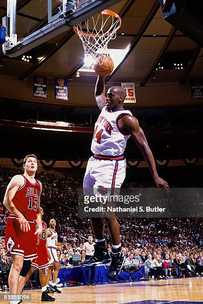 Anthony Mason of the New York Knicks grabs the rebound against Luc Longley of the Chicago Bulls in Game Two of the Eastern Conference Semifinals...