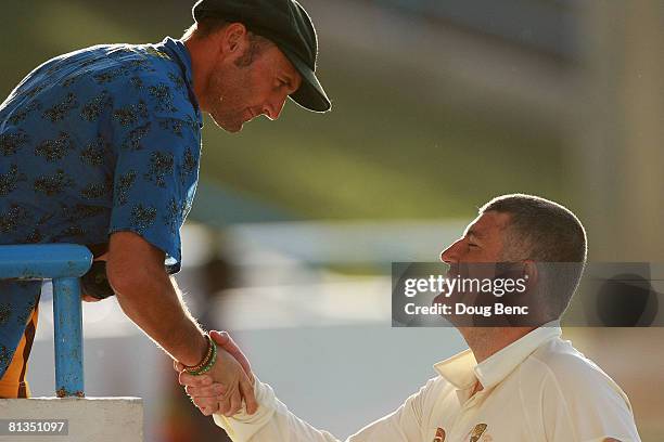 Stuart MacGill of Australia greets Australian fans after day four of the Second Test match between West Indies and Australia at Sir Vivian Richards...