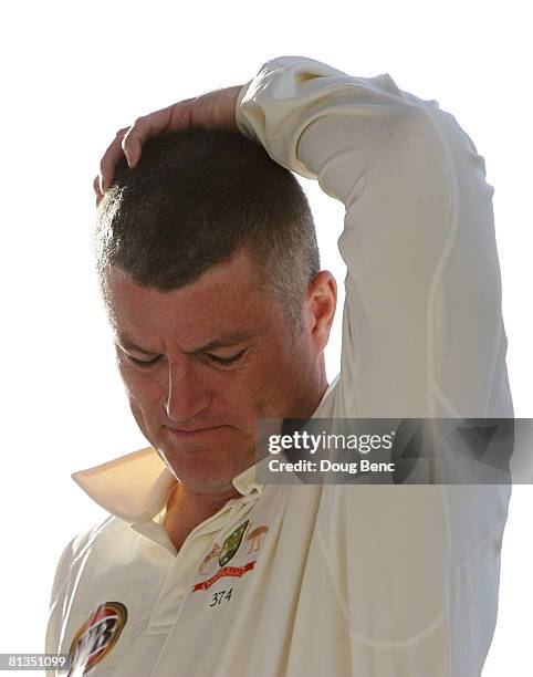 Stuart MacGill of Australia walks on to the field at the end of play on day four of the Second Test match between West Indies and Australia at Sir...