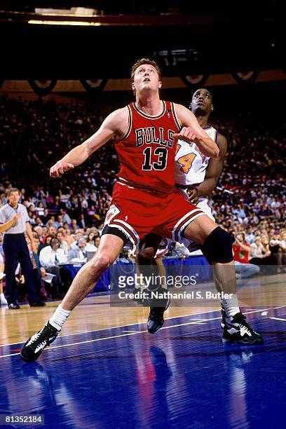 Luc Longley of the Chicago Bulls boxes out against Anthony Mason of the New York Knicks in Game Seven of the Eastern Conference Semifinals during the...