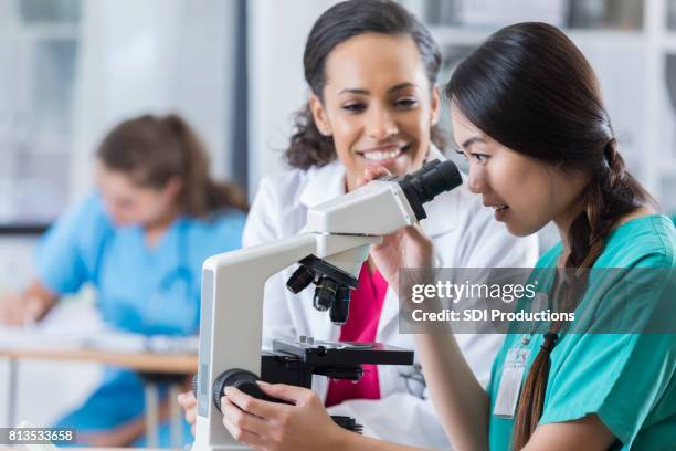 Student Using A Microscope 535 Medical Student Microscope Stock Photos, High-Res Pictures, and ...