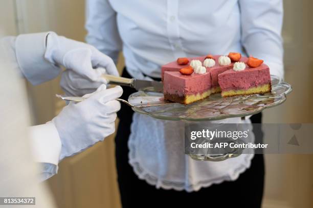 Women learn how to serve a dessert during a lesson at the Switzerland's last finishing school Institut Villa Pierrefeu on June 26, 2017 in Glion....